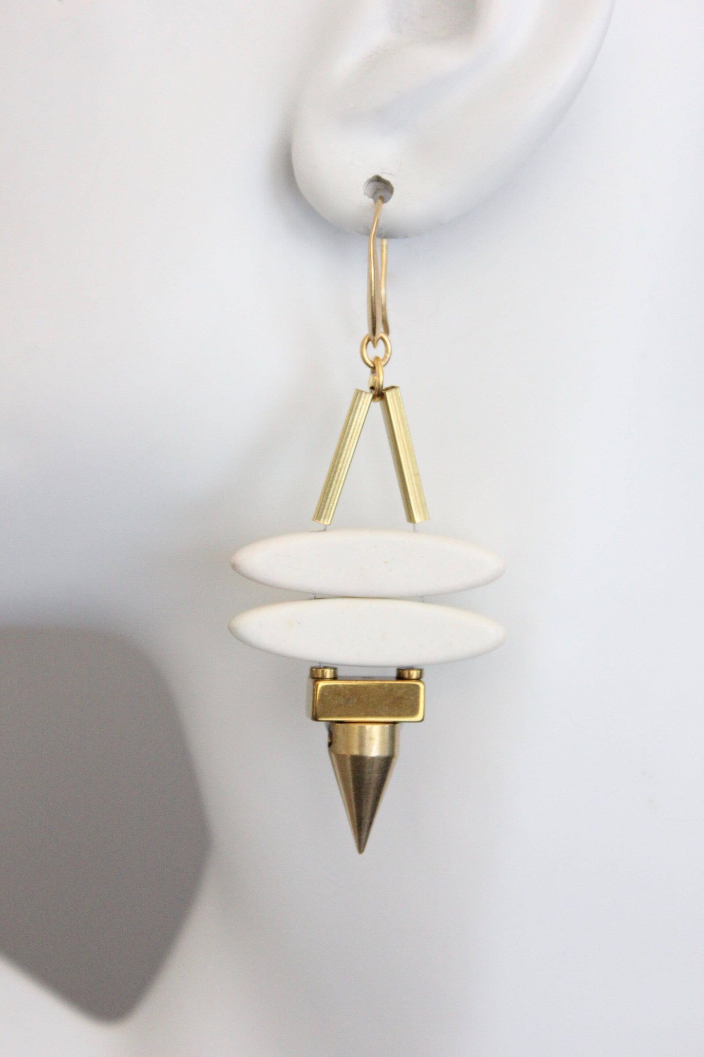 Geometric white stone ellipse & brass spike earrings