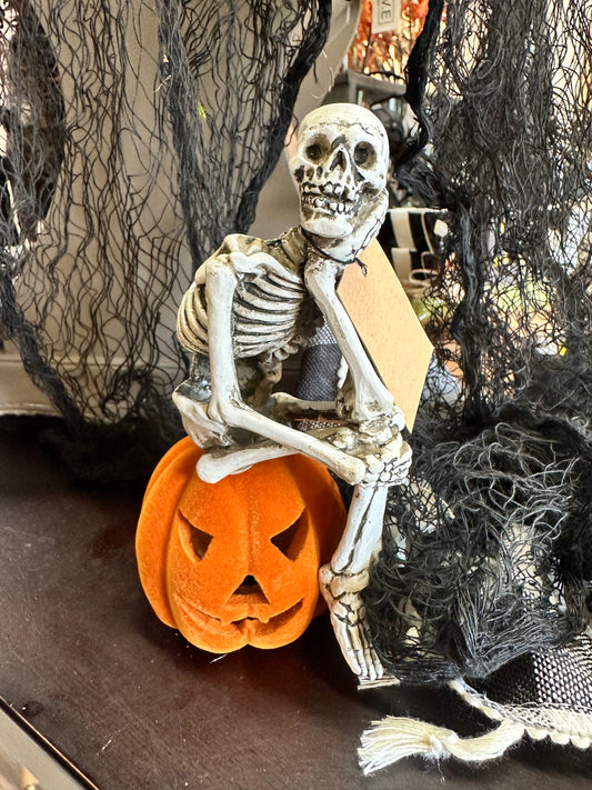 4'x6 1/2" Resin Skeleton Sitting on Jack-O-Lantern